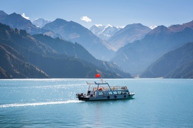 scenery of heaven lake, tianshan tianchi national geopark.with tourist boat in september