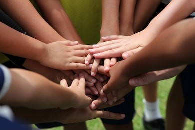 group of young people's hands