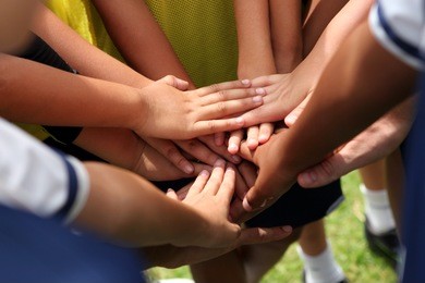 group of young people's hands