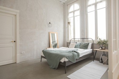 interior bedroom of white and gray cozy bed