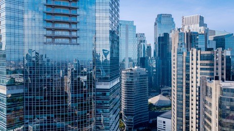 aerial view of office buildings in jakarta central business district, indonesiaaerial view of modern office buildings under blue sky in jakarta central business district, indonesia