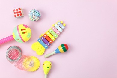 table top view aerial photo of kids toys collection background concept.flat lay objects for development children on modern pink paper on office desk.free space for creative design add text & word.