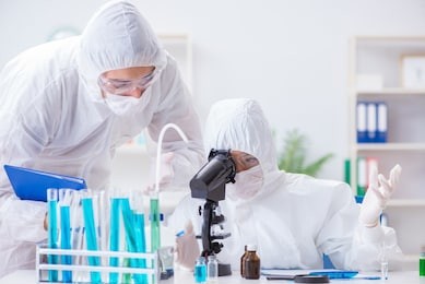 two scientists working in the chemical lab