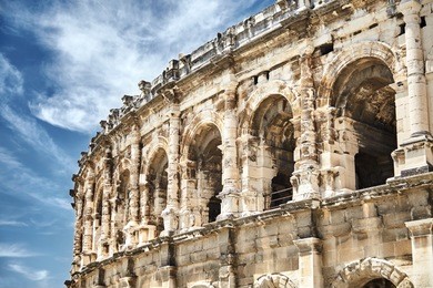 view on the ancient roman amphitheatre in nimes city in the occitanie region of southern france. magnificent huge arena