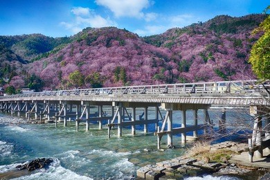 togetsu-kyu bridge over katsura river in arashiyama, kyoto, japan