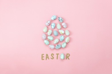 top view shot of arrangement decoration happy easter holiday background concept.flat lay colorful bunny eggs with accessory text on modern beautiful pink paper at office desk.design pastel tone.