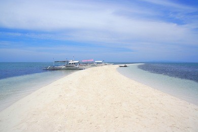tourist ships anchoring along pontod the virgin island in bohol, the philippines