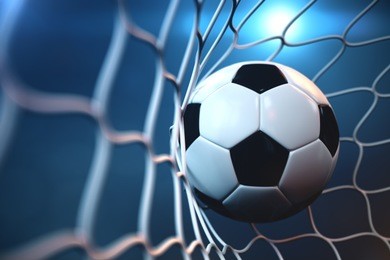 3d rendering soccer ball in goal. soccer ball in net with spotlight or stadium light background, success concept