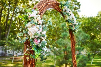 beautiful pink and white flowers and greenery on wedding arch prepared for wedding ceremony outroods, copy space. wedding ceremony decorations, free space