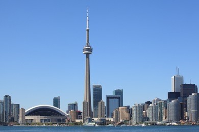 photo of the toronto skyline under a clear sky.
