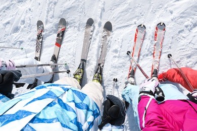 friends on ski piste at snowy resort. winter vacation