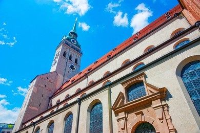 clock tower of saint peter church in munich, germany