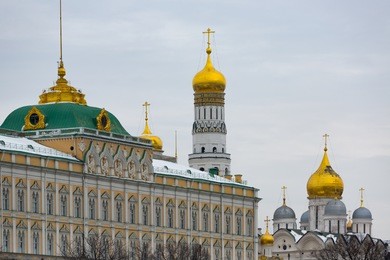 great kremlin palace, evan the great bell tower and archangel cathedral as seen from across the moskva river in moscow, russia.