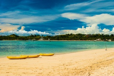 banana boats on a beach in fiji for honey moon after wedding, marraige