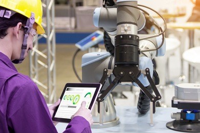 industry 4.0 robot concept .engineers use laptop computers for machine maintenance, automation tools, robot arm at the factory.
