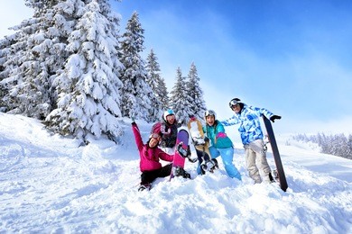 friends at snowy ski resort. winter vacation