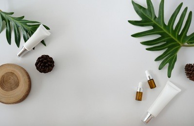 natural cosmetic cream serum skincare blank bottle packaging with leaves herb wood bio organic product.beauty and spa concept.