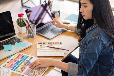 graphic designers work with computer and mouse pen design products and websites, graphic designers concept