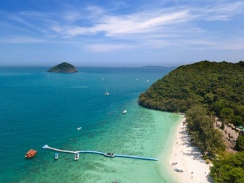 aerial of cabin cruiser and speedboath on the big ocean in andaman at koh he or coral island, phuket, thailand