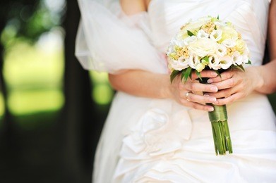 bride holding wedding bouquet in hands