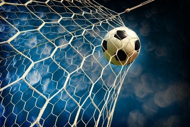 soccer field with a ball in goal