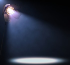 the lights illuminate the area where someone or something important is in the spotlight. his text or image in the center of the lights.