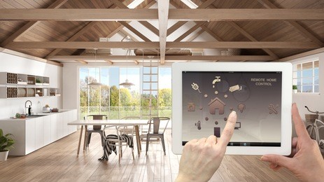 smart remote home control system on a digital tablet. device with app icons. interior of modern kitchen and living room in the background, architecture design, 3d illustration