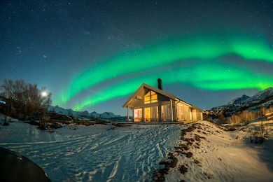 the beautiful aurora in norway is dancing all over the sky.