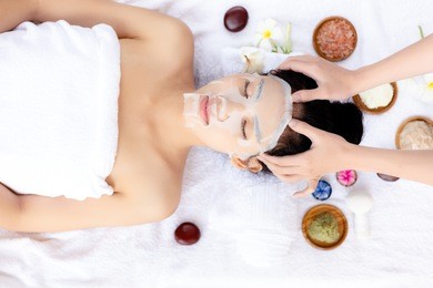 massager massage on her head, make beautiful woman relieve stress from work and makes her feel relaxed. attractive beautiful lady love massage, aromatherapy at spa shop. it has nice smell from herbs