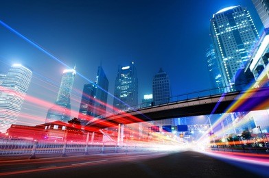 the light trails on the modern building background in shanghai china.