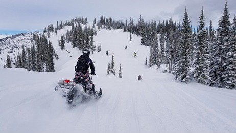 a snowmobiler in the monashees near revelstoke, canada