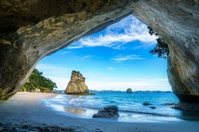 view from the cave at cathedral cove beach,coromandel,new zealand