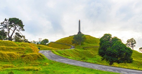 landscape view of one tree hill park auckland new zealand; calm morning time with a cloudy period