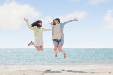 japanese girls play on the beach