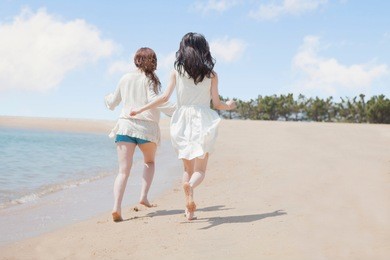 japanese girl playing in seaside