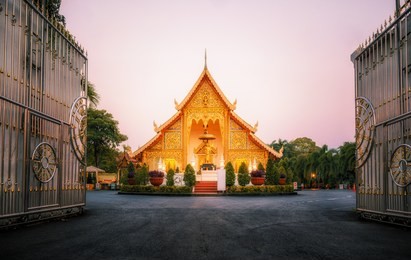 stunning wat phra singh woramahawihan buddhist temple at sunrise in chiang mai, thailand