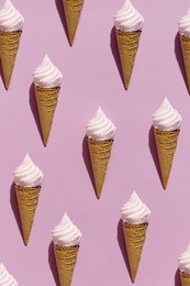 colorful layout of waffle cones with ice-cream in seamless background on pink.