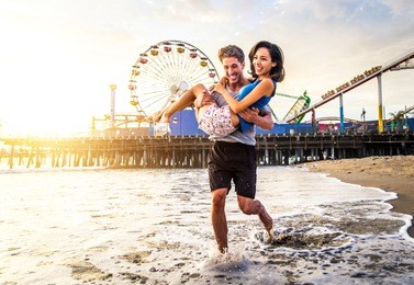 couple of lovers on a romantic date at the beach at sunset