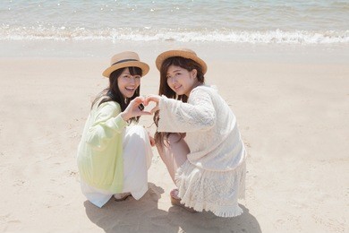 japanese girls play on the beach