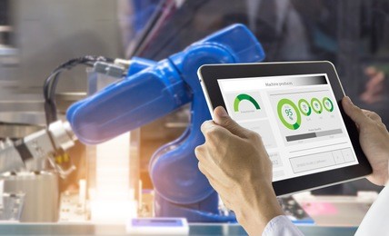 industry 4.0 robot concept .engineers use laptop computers for machine maintenance, automation tools, robot arm at the factory.