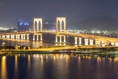 sai van bridge at night in macau, china