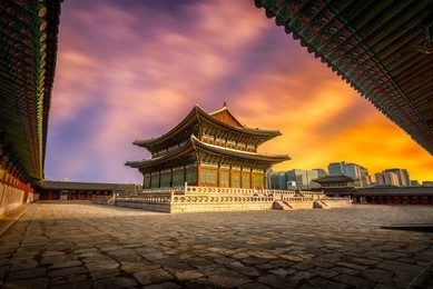 gyeongbokgung palace in south korea, with the name of the palace 'gyeongbokgung' on a sign