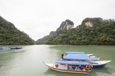 tourist boats , langkawi landscape, holidays motorboats around pregnant lady island langkawi in the arabian sea, malaysia, langkawi dayang bunting