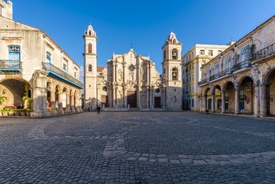 view of the square of the cathedral of the virgin mary in havana, cuba (plaza de la catedral de la virgen maría de la concepción inmaculada de la habana in spanish), on a sunny morning.