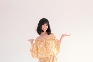fashion portrait of young cute asian woman wearing vintage yellow floral dress