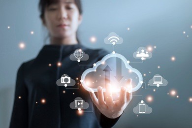 business woman holding icon cloud computing network and icon connection data information in hand. cloud computing and technology concept. 