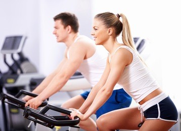 young people on bikes in a fitness club