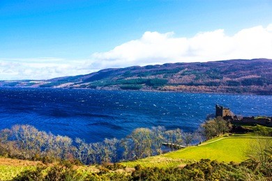 landscape view of urquhart castle along loch ness lake  in scotland, united kingdom.