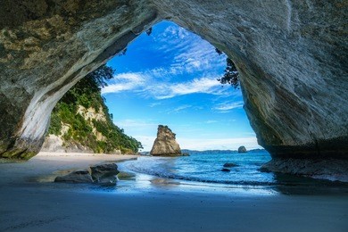 view from the cave at cathedral cove beach,coromandel,new zealand
