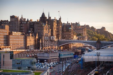 edinburgh skyline as viewed from the calton hill with the old town, north bridge, waverley railway station and edinburgh castle in background